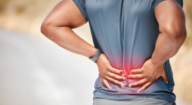 Physician evaluating a patient with lower back pain at 14 Street Medical Arts, a practice accepting Molina Healthcare in New York City